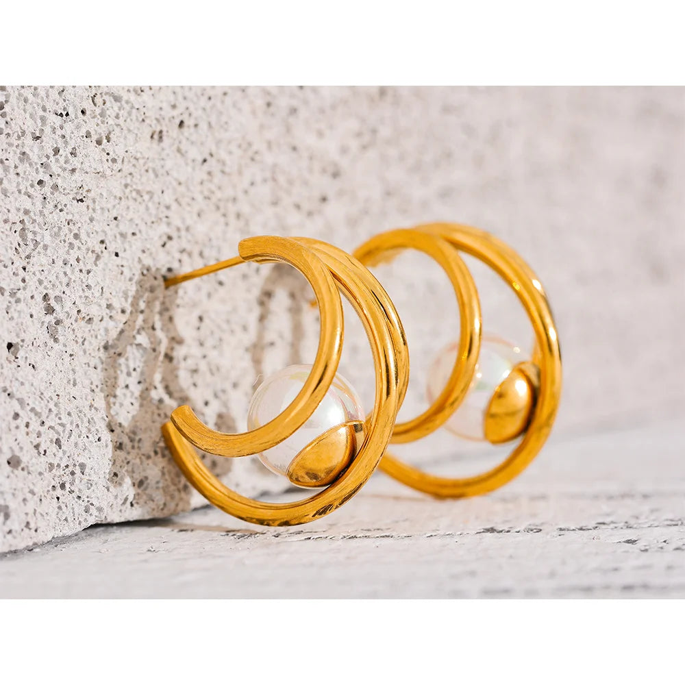 Orecchini multicerchio con perla