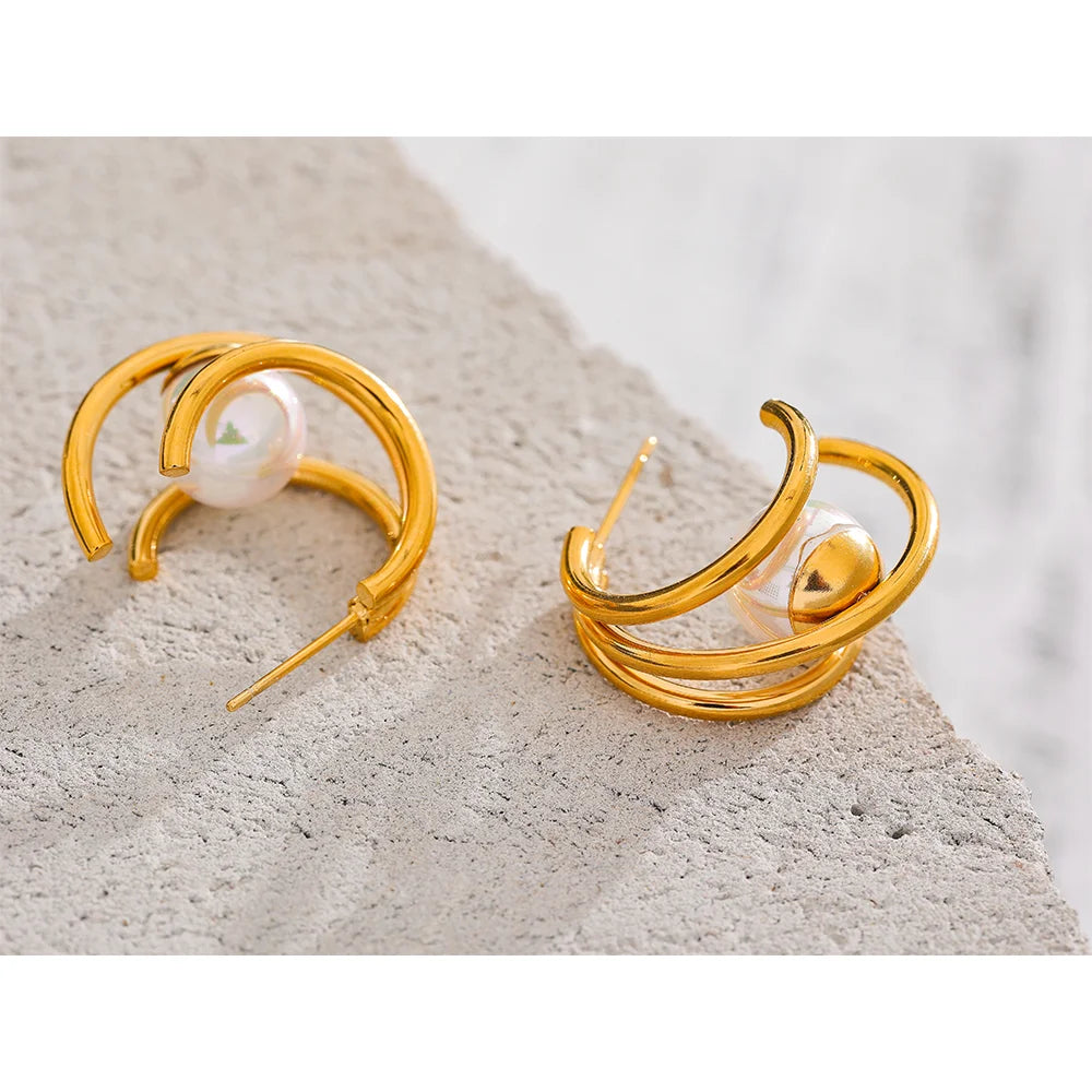 Orecchini multicerchio con perla